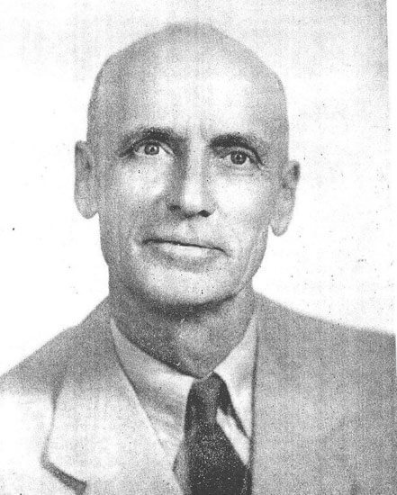 tarpening-george Bald man in suit, looking directly at camera.